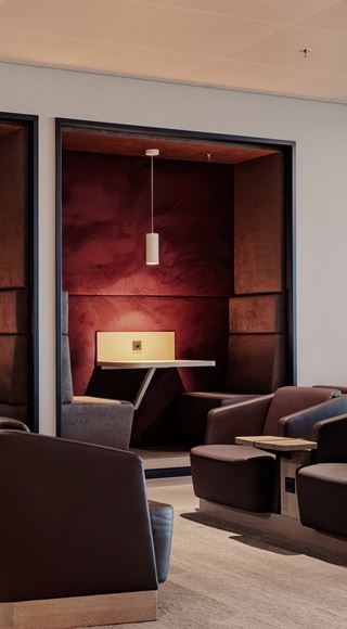 A Man Making Use Of The Business Facilities At The Amsterdam Aspire Lounge 26